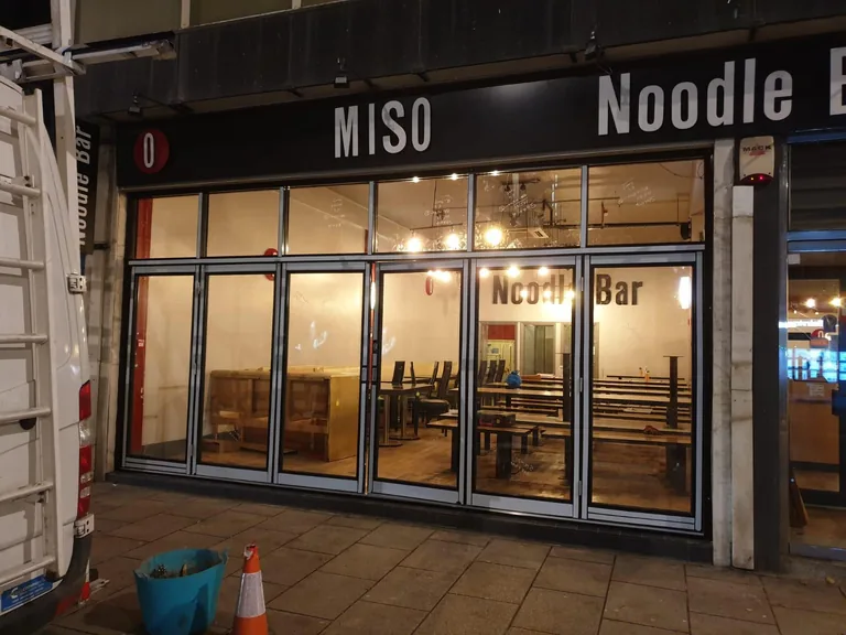 Aluminium bi-fold commercial entrance.