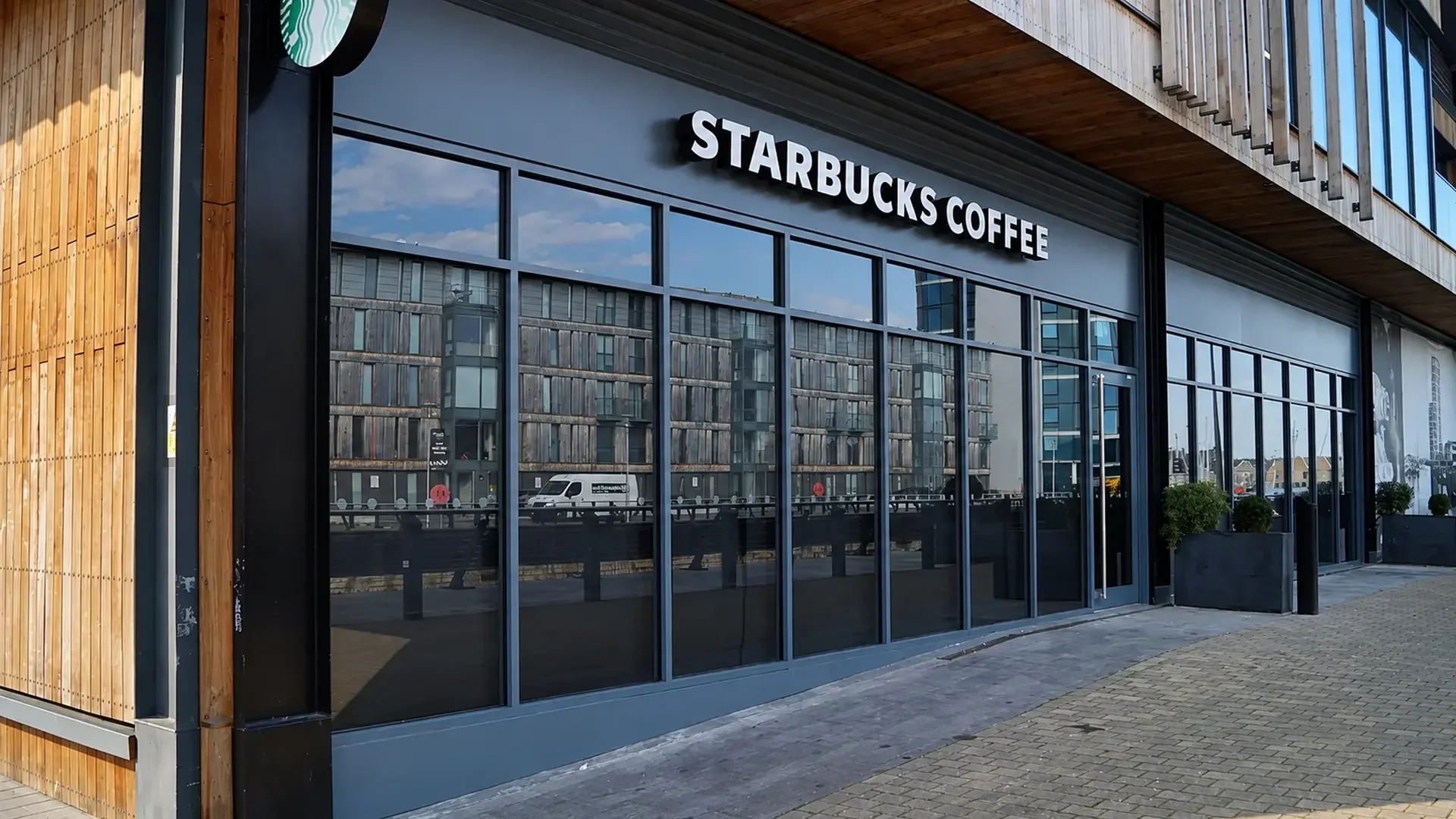 Dark aluminium shopfront installation at a commercial property in London.