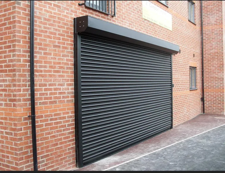 Commercial roller shutter installed across a shopfront opening.