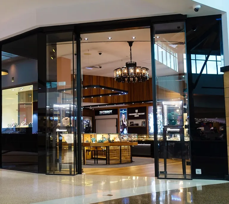 Full-height glazed commercial frontage with dark framing.