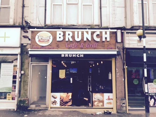 Aluminium café entrance with full-height glazed doors.