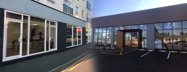 Aluminium and glass shopfront with roller shutter provision.