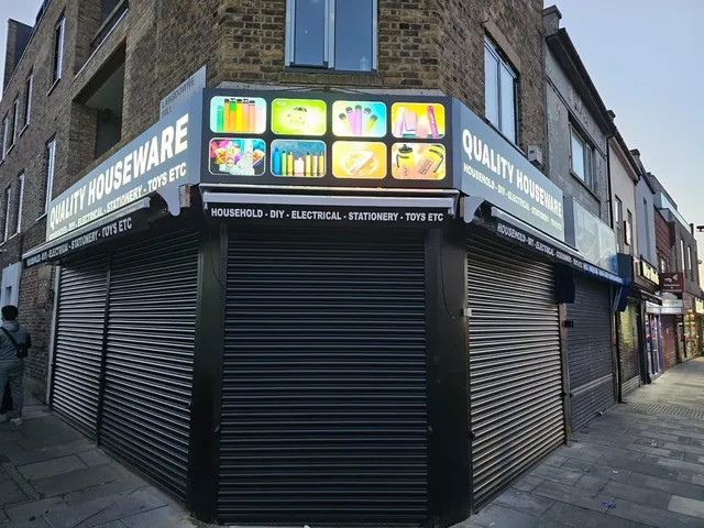 Commercial corner roller shutters fitted to a retail property.
