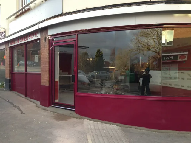 Curved aluminium and glass commercial shopfront.