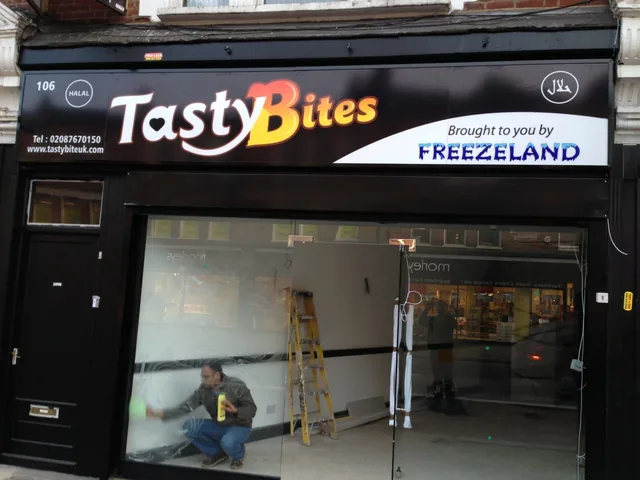 Powder-coated aluminium restaurant shopfront and glazing.
