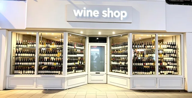 Traditional timber-style retail shopfront with display glazing.
