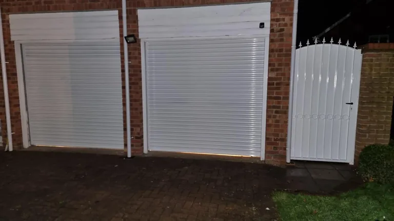 Closed roller shutter across a commercial frontage.