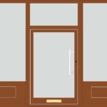 Wooden shopfront with large display windows and recessed entrance